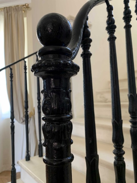 BLACK CAST IRON RAILINGS ON MARBLE STAIRCASE 